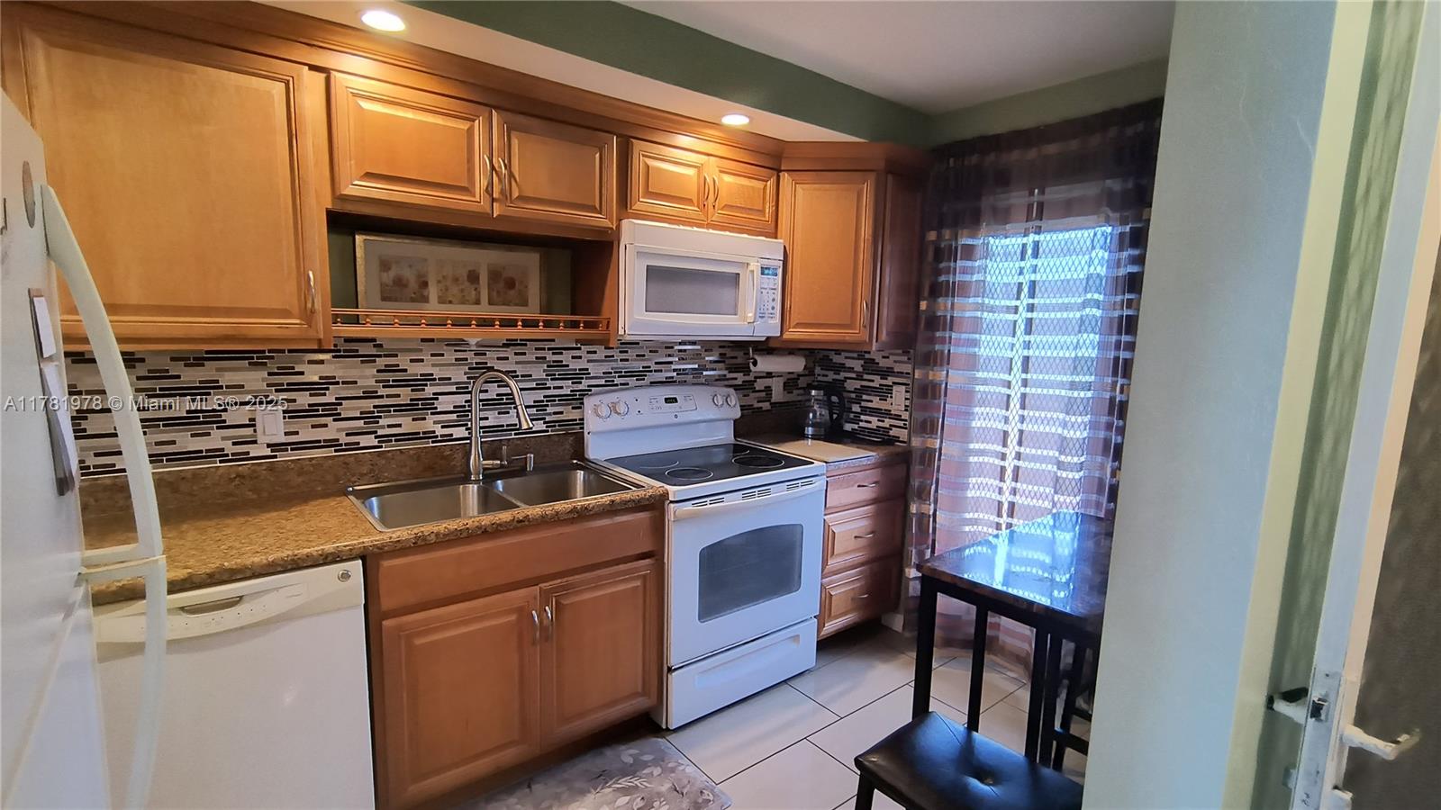 4500 North Federal Highway, Unit 352F Lighthouse Point, FL 33064 - Photo 3 of 32 a kitchen with stainless steel appliances granite countertop a stove and a sink