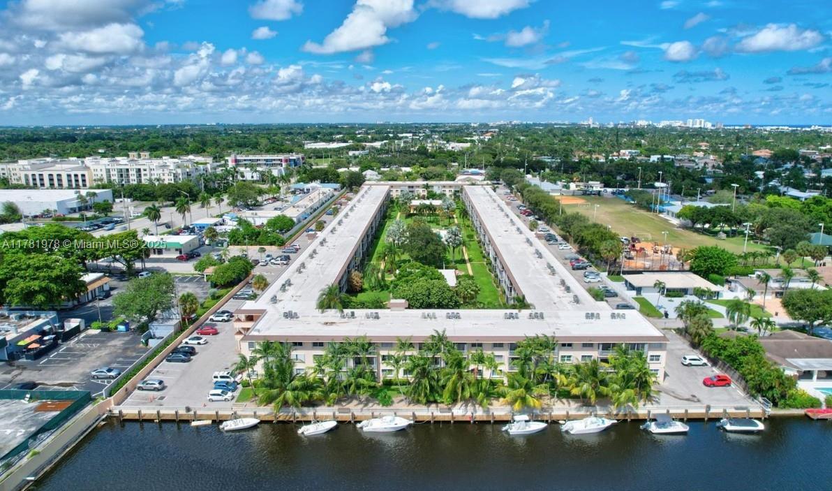 4500 North Federal Highway, Unit 352F Lighthouse Point, FL 33064 - Photo 32 of 32 an aerial view of residential houses with outdoor space and swimming pool