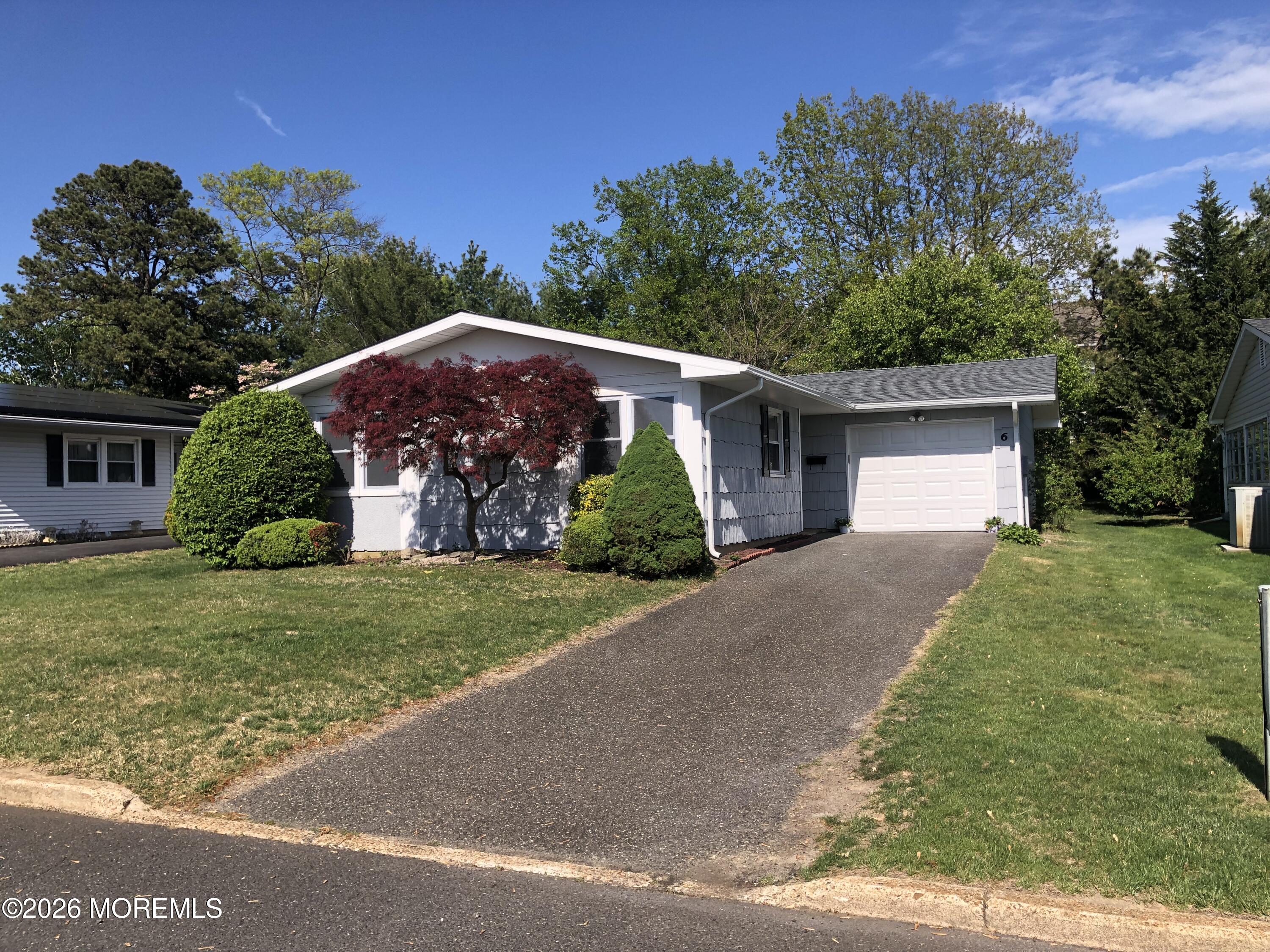 6 Dickinson Road Brick, NJ 08724 - Photo 2 of 17 a front view of a house with garden