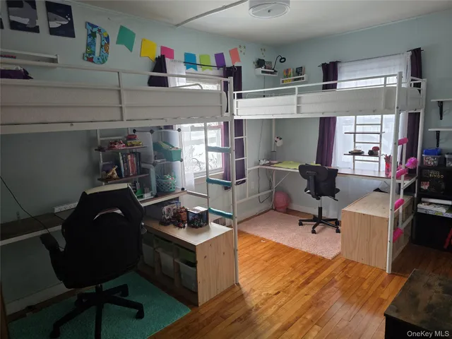 a work place with table chairs and a workspace