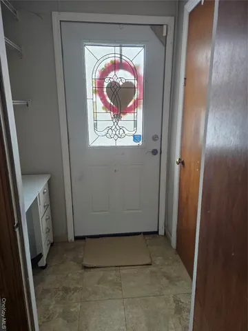 a view of room with window and hardwood floor