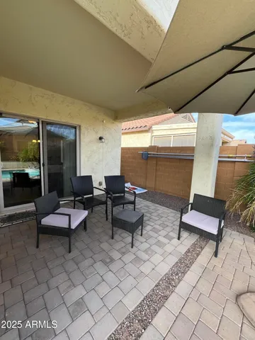 a outdoor space with lots of white furniture