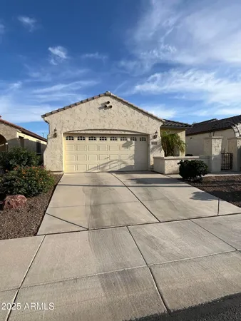 a front view of a house with a garage