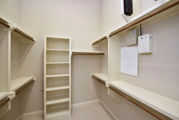 a bathroom with a bathtub double sink and mirror