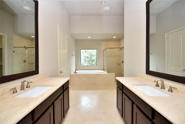 a bathroom with a tub and shower