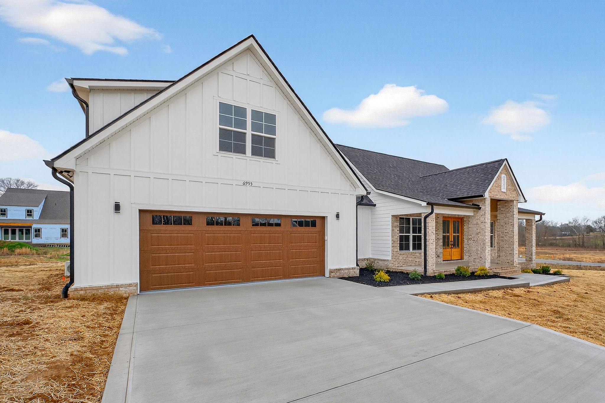 6955 Sweet Magnolia Way Baxter, TN 38544 - Photo 15 of 53 a front view of the house with garage