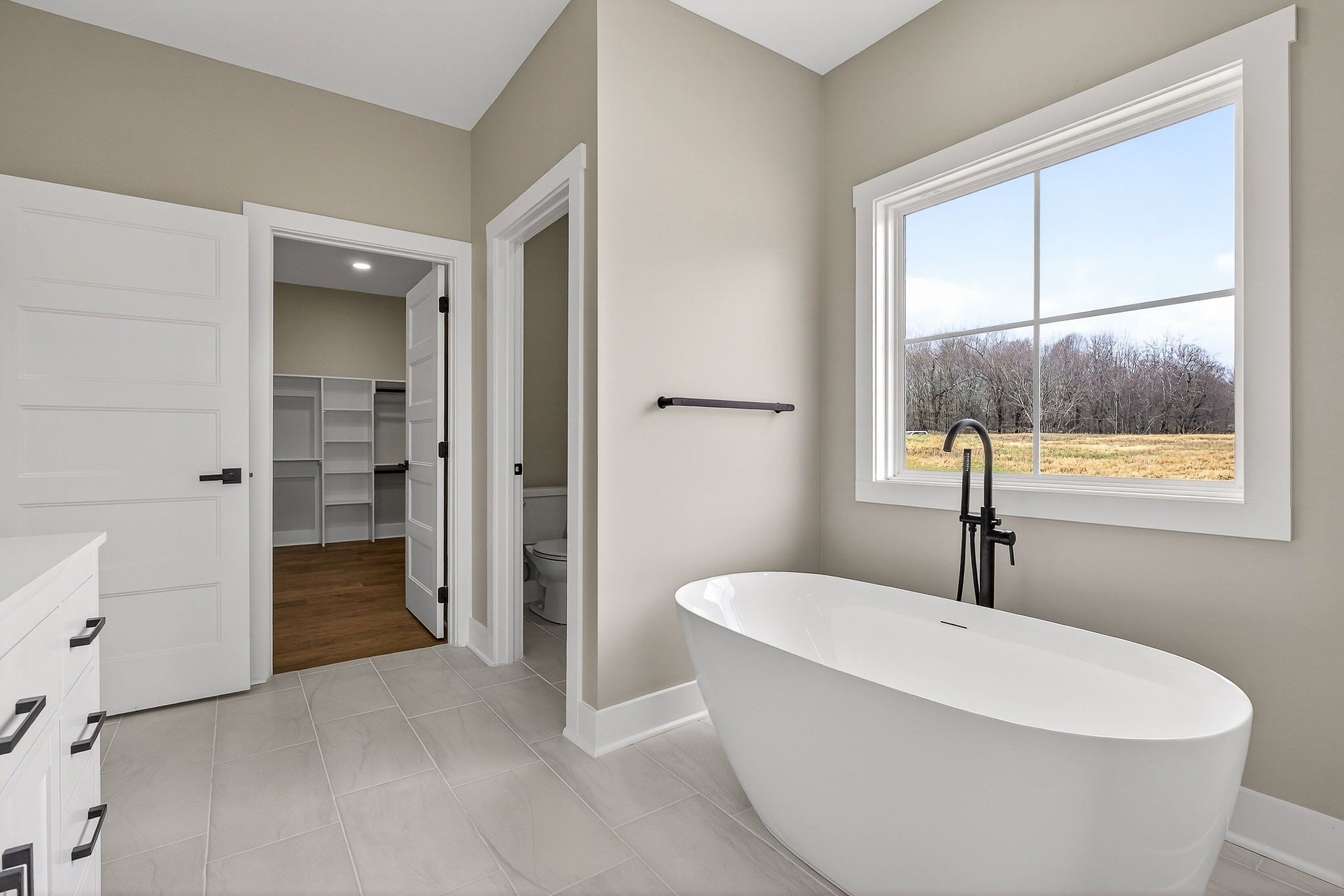 6955 Sweet Magnolia Way Baxter, TN 38544 - Photo 20 of 53 a white bath tub sitting in a bathroom
