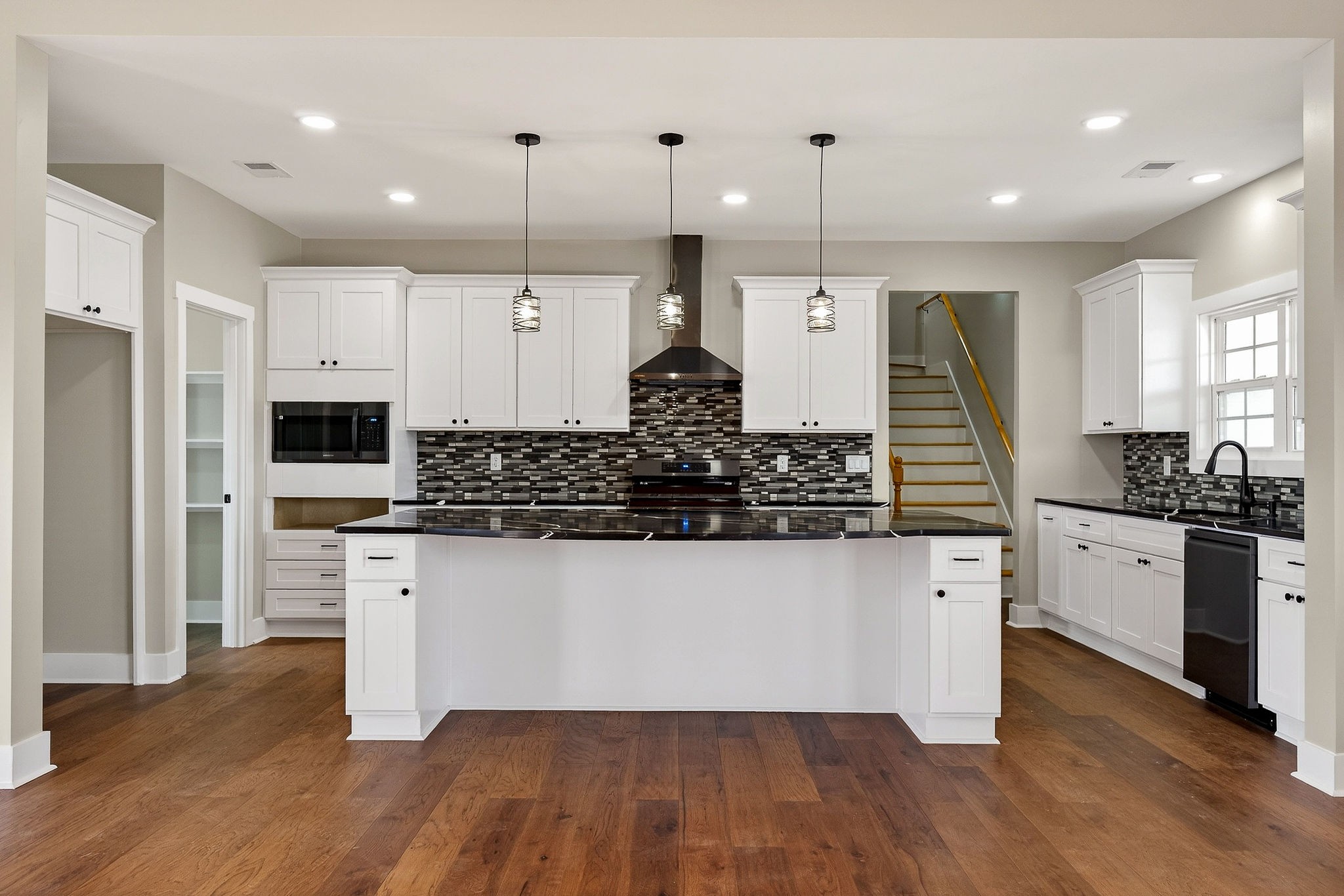 6955 Sweet Magnolia Way Baxter, TN 38544 - Photo 2 of 53 a kitchen with stainless steel appliances granite countertop a stove a sink and a refrigerator