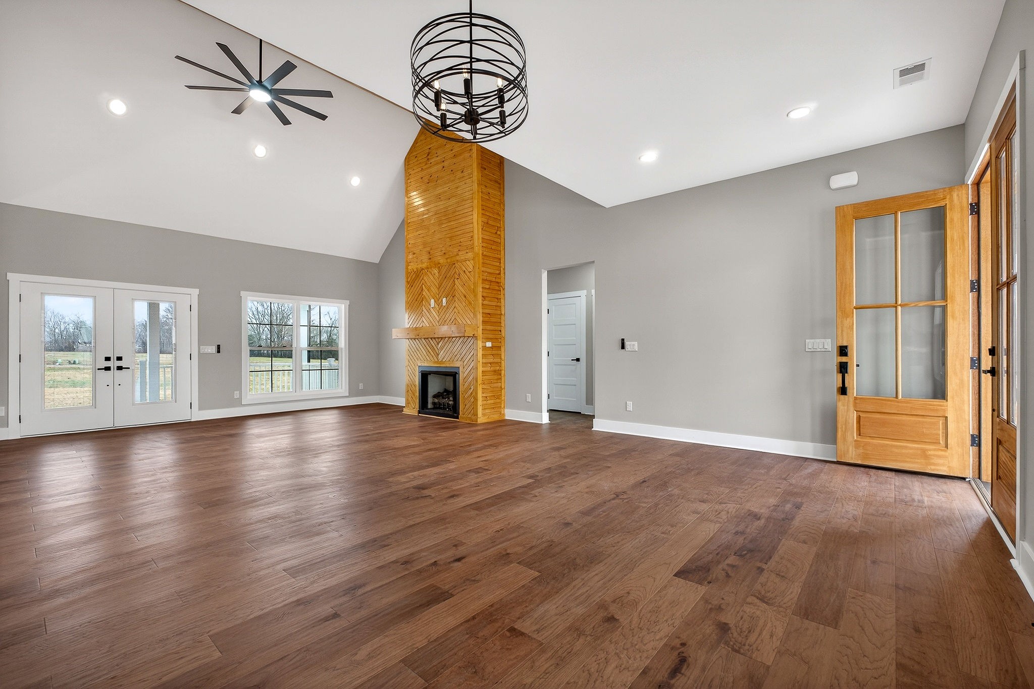 6955 Sweet Magnolia Way Baxter, TN 38544 - Photo 3 of 53 an empty room with wooden floor and windows