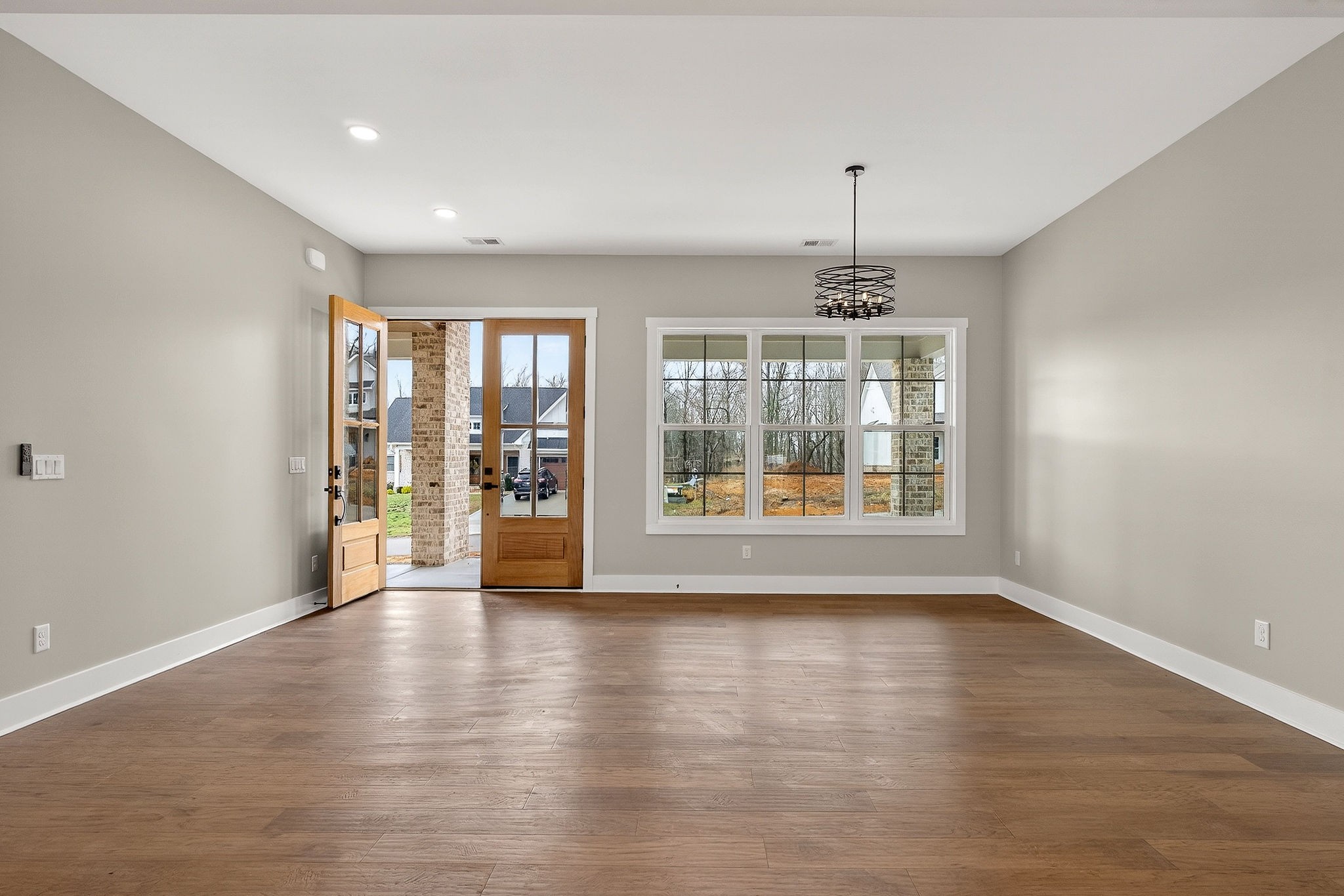 6955 Sweet Magnolia Way Baxter, TN 38544 - Photo 32 of 53 a view of an empty room with a window and wooden floor