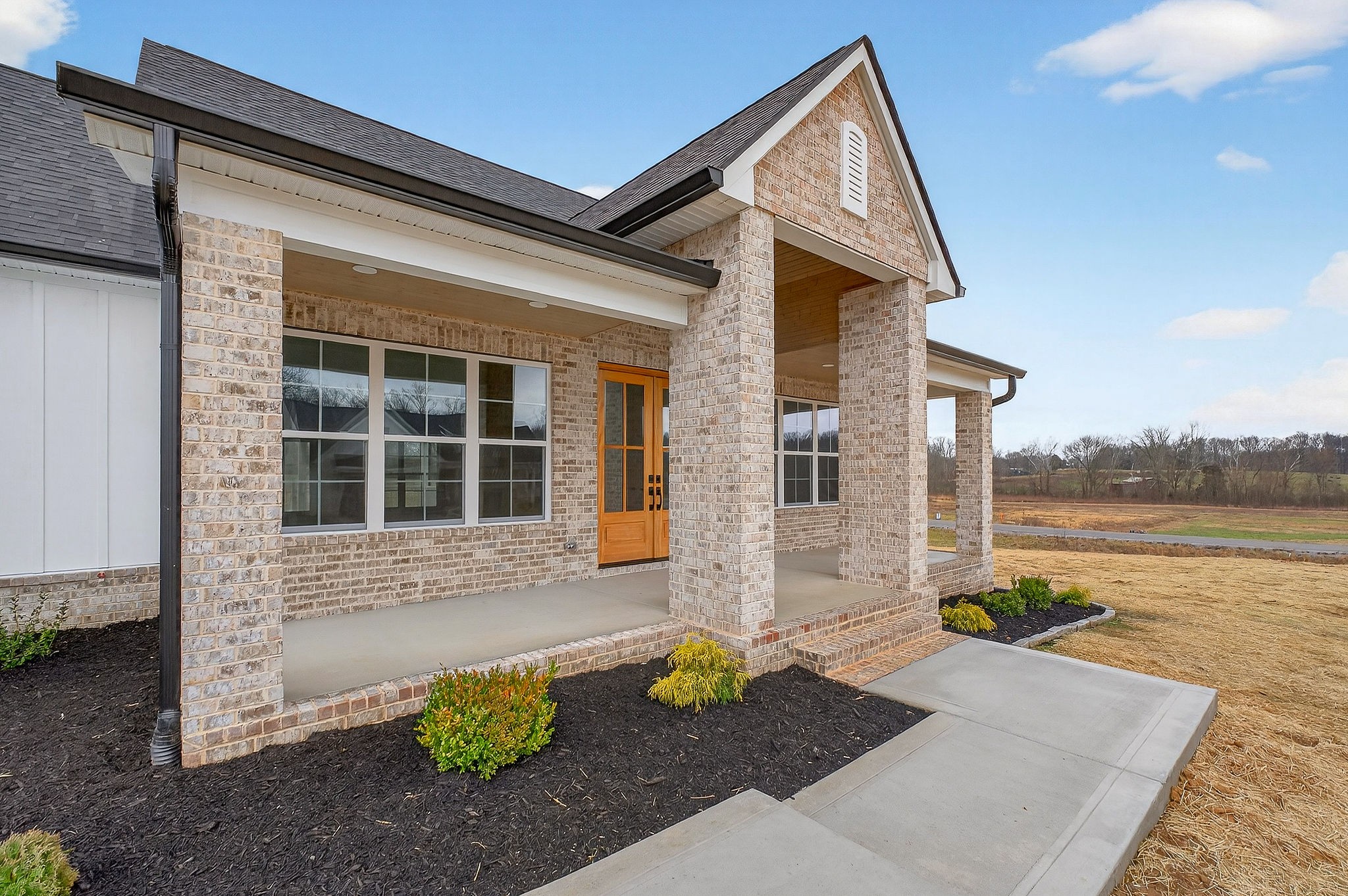 6955 Sweet Magnolia Way Baxter, TN 38544 - Photo 34 of 53 a front view of a house with a yard