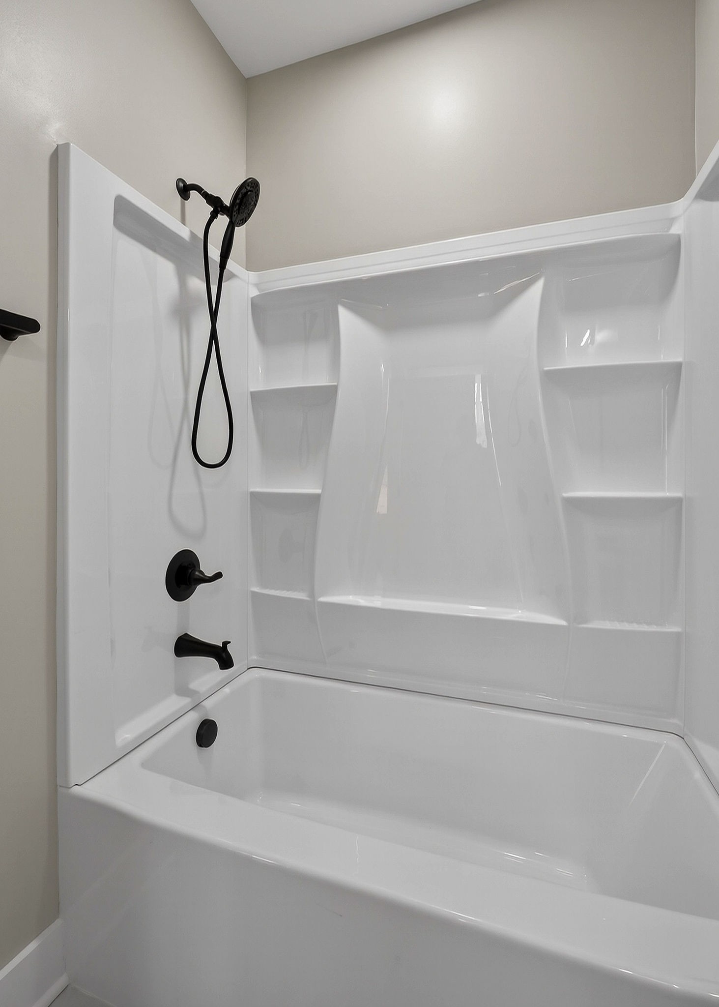 6955 Sweet Magnolia Way Baxter, TN 38544 - Photo 39 of 53 a bathroom with a bath tub with a shower