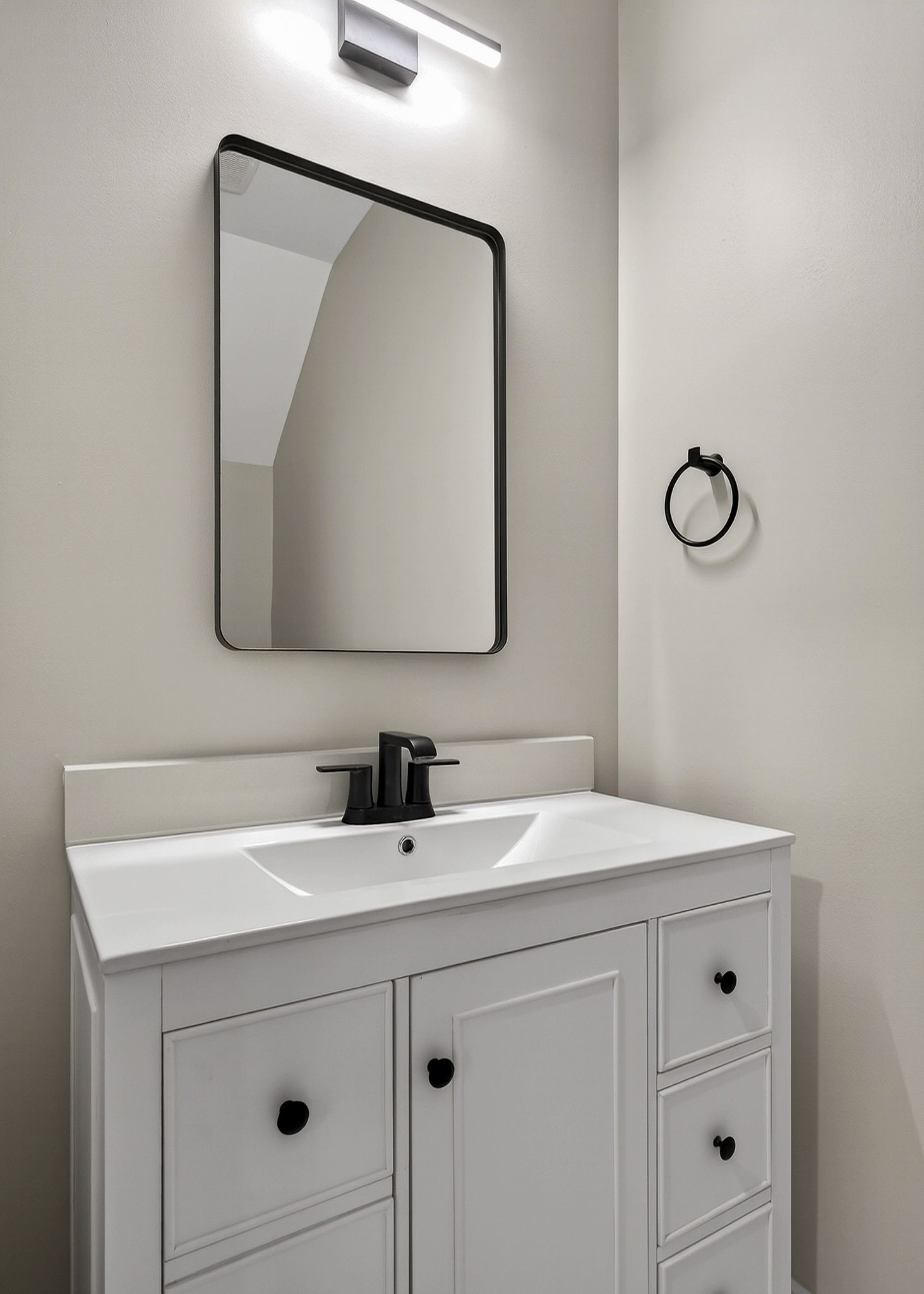 6955 Sweet Magnolia Way Baxter, TN 38544 - Photo 44 of 53 a bathroom with a sink vanity and mirror