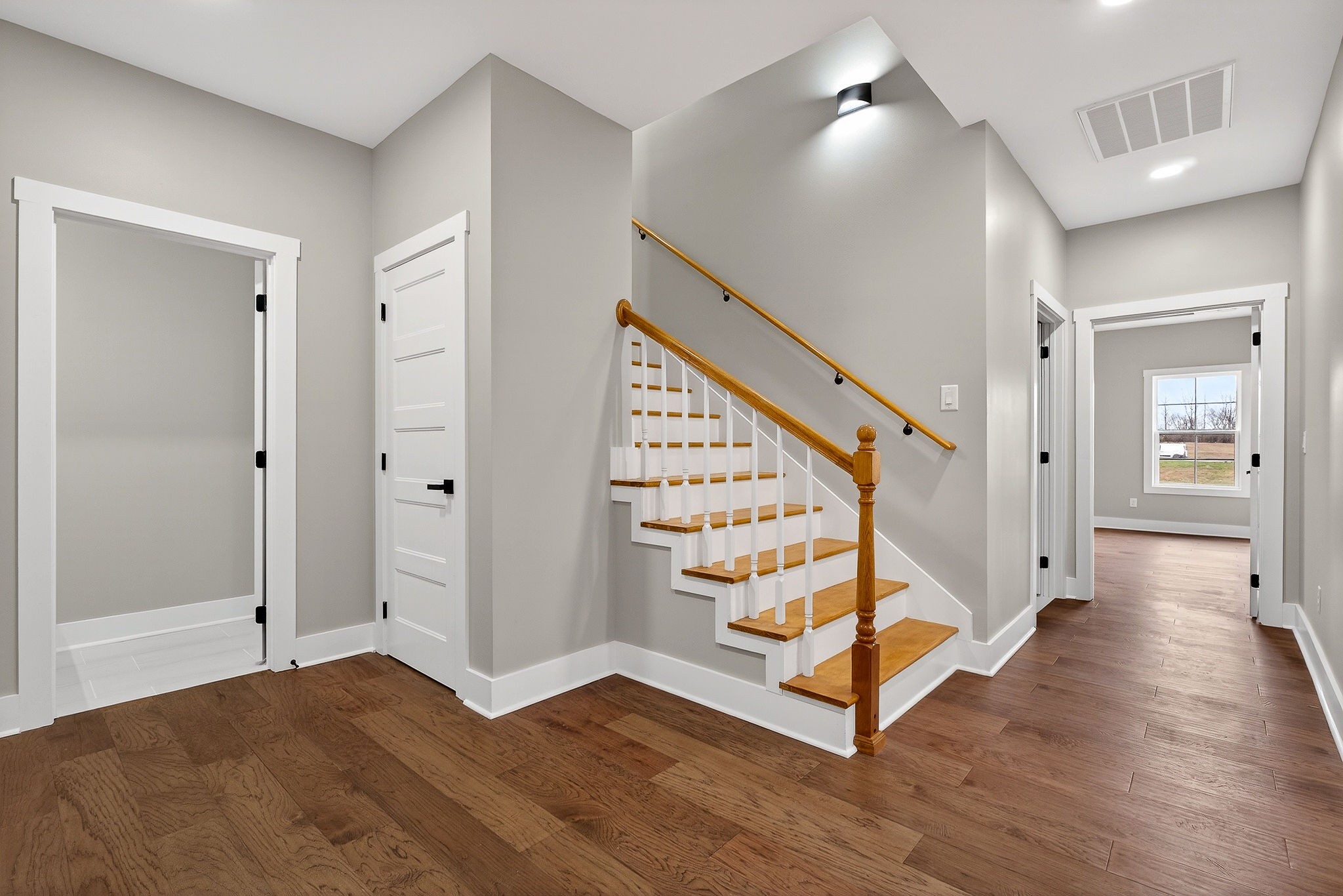 6955 Sweet Magnolia Way Baxter, TN 38544 - Photo 45 of 53 a view of an entryway with wooden floor and hallway