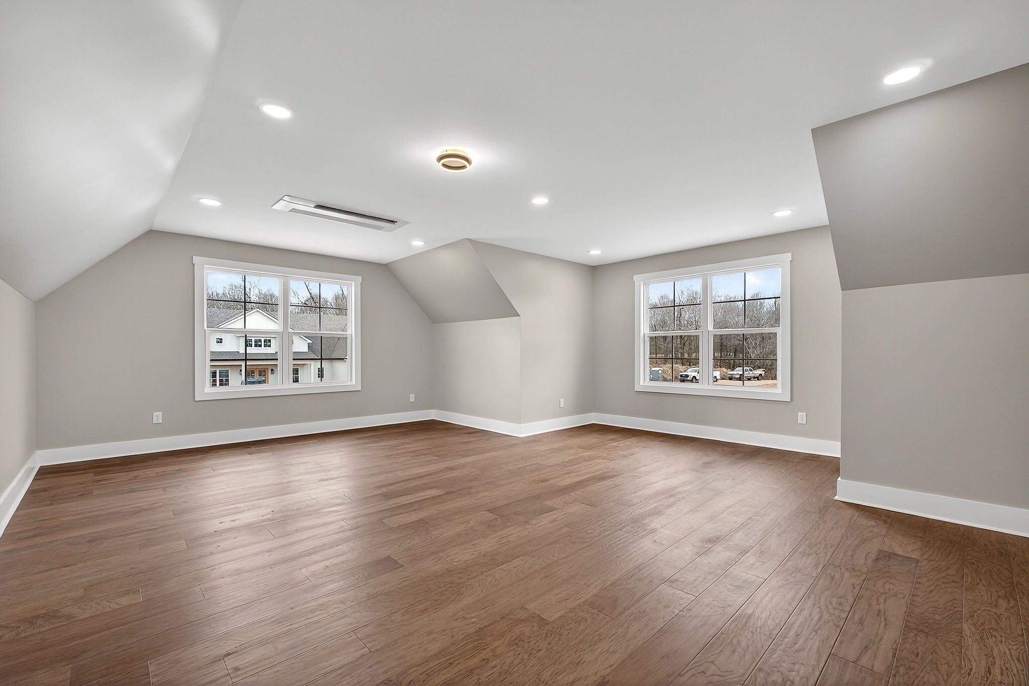 6955 Sweet Magnolia Way Baxter, TN 38544 - Photo 47 of 53 an empty room with wooden floor and windows
