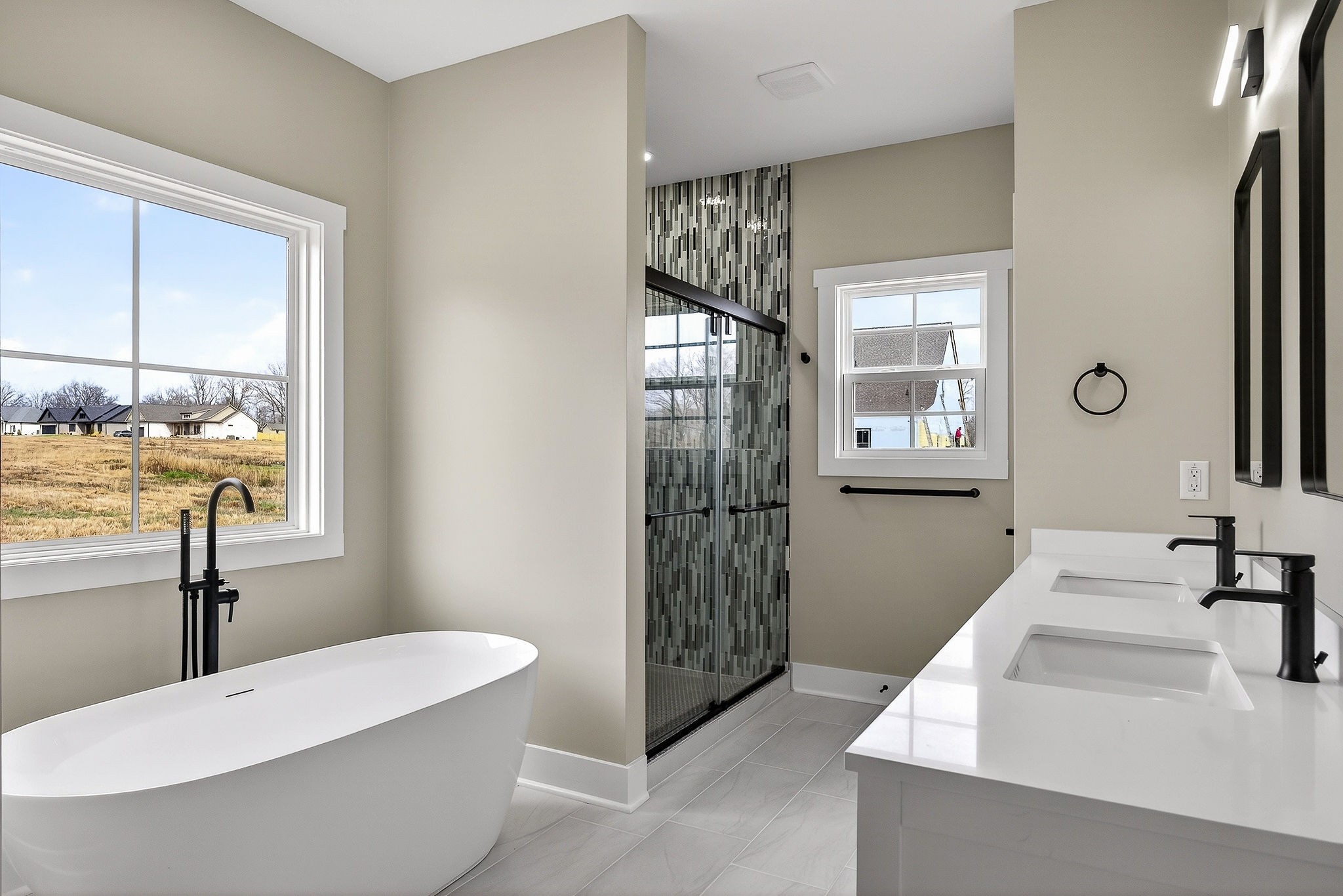 6955 Sweet Magnolia Way Baxter, TN 38544 - Photo 5 of 53 a bathroom with a bathtub sink and mirror