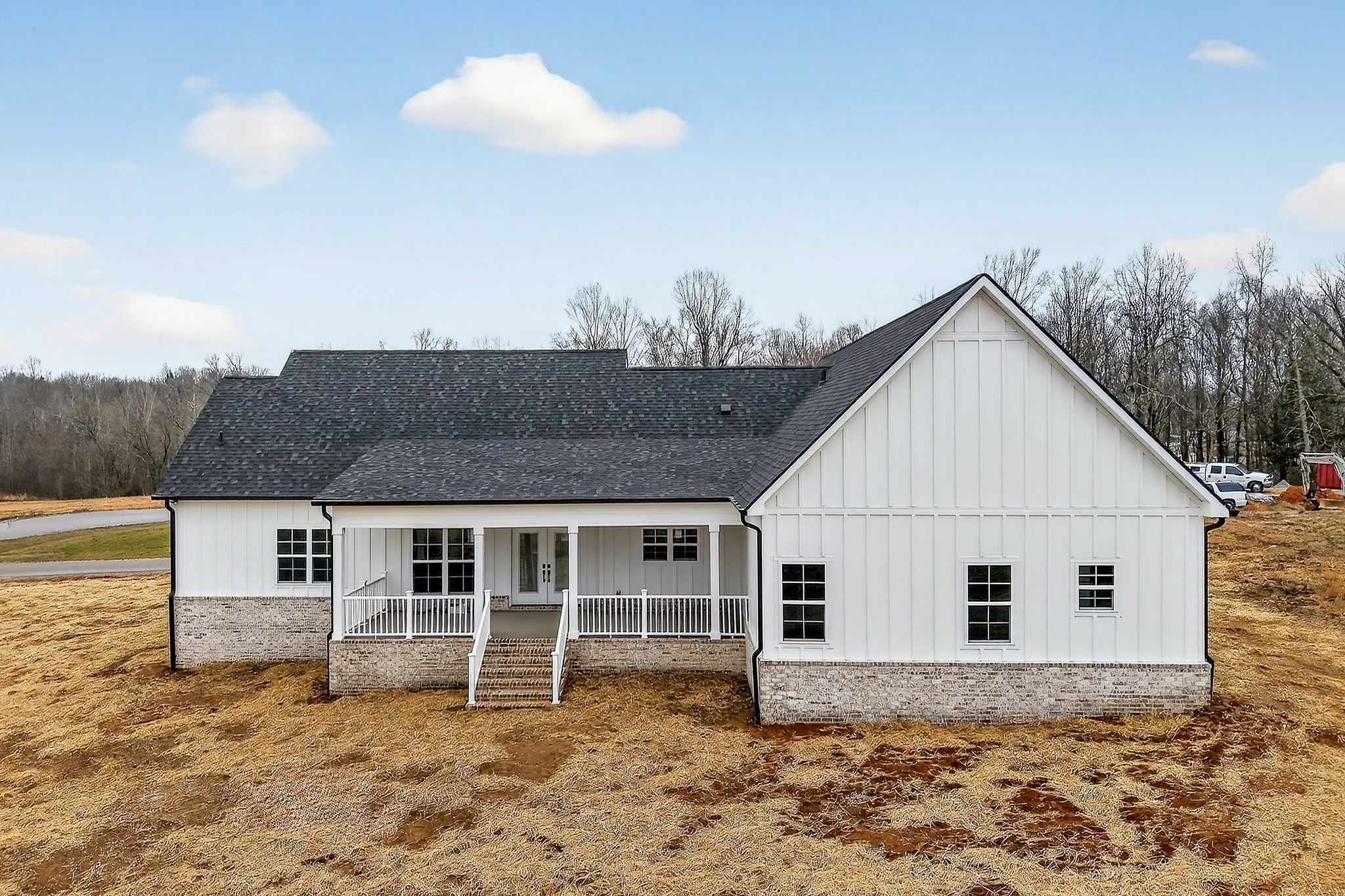 6955 Sweet Magnolia Way Baxter, TN 38544 - Photo 7 of 53 a front view of a house with a yard