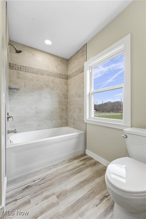 3793 Ranfield Road Kent, OH 44240 - Photo 24 of 40 Full bathroom featuring shower / washtub combination and light wood-style flooring