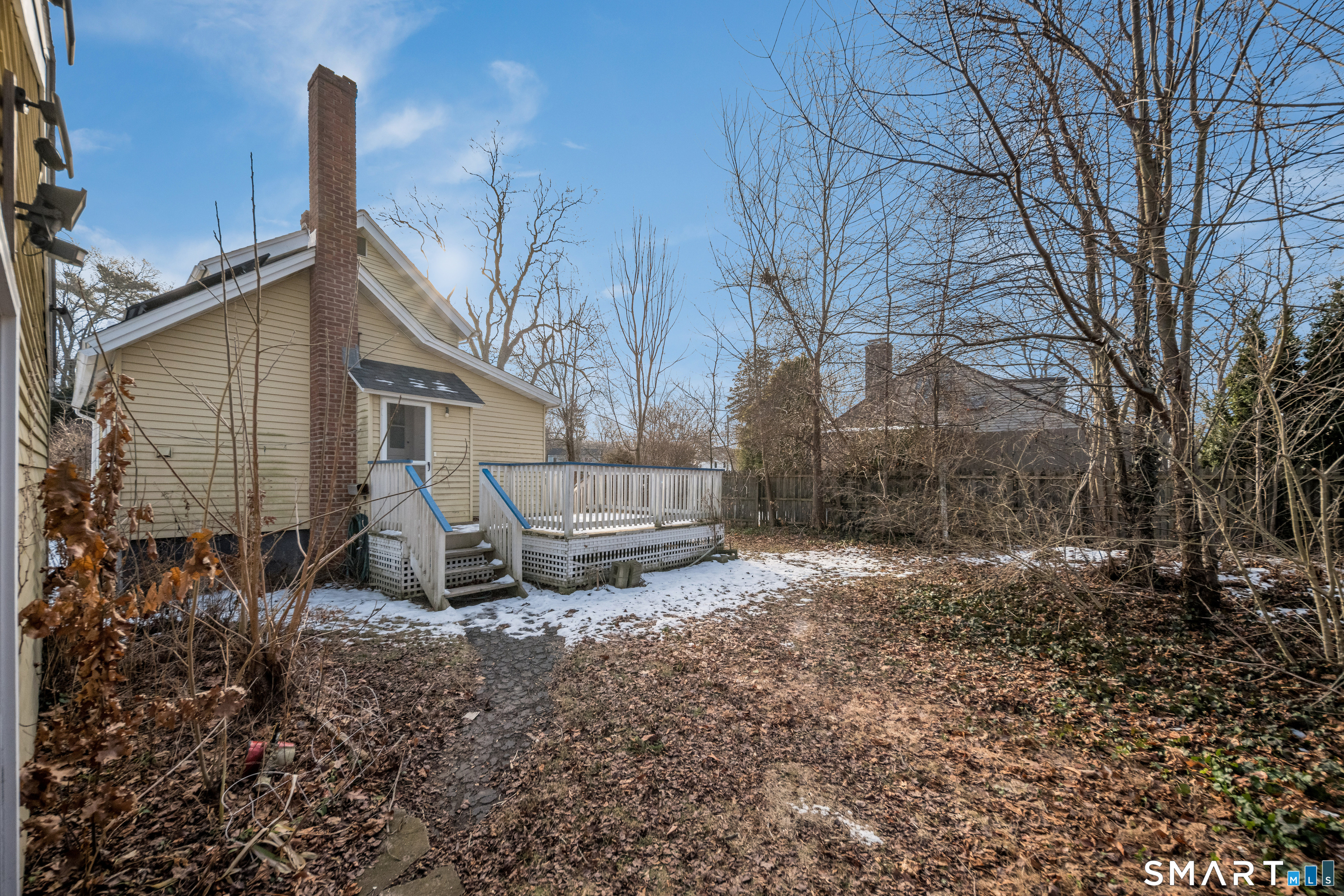 38 Grove Street Branford, CT 06405 - Photo 17 of 20 a white house sitting in middle of the forest