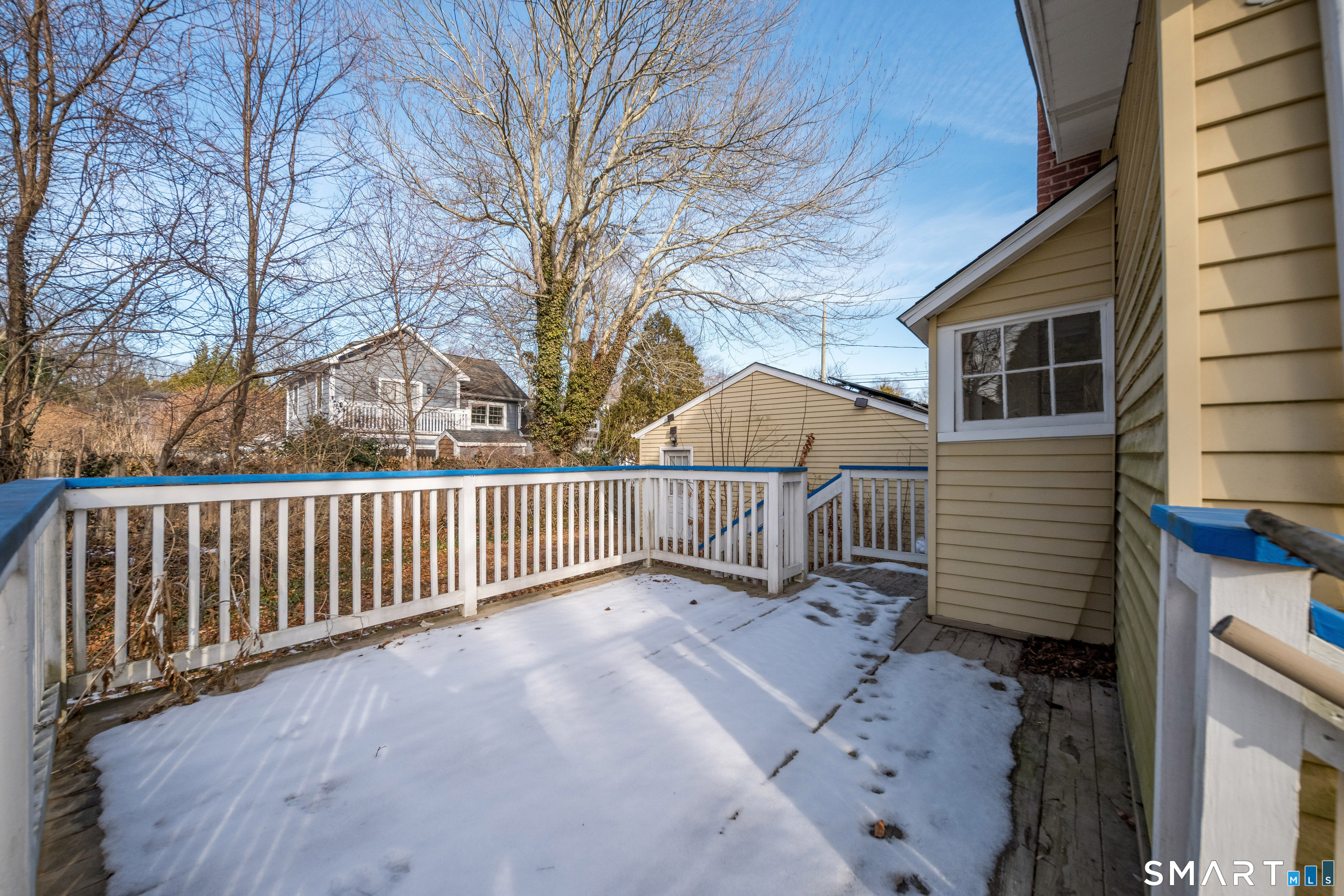 38 Grove Street Branford, CT 06405 - Photo 19 of 20 a view of backyard with deck and wooden fence