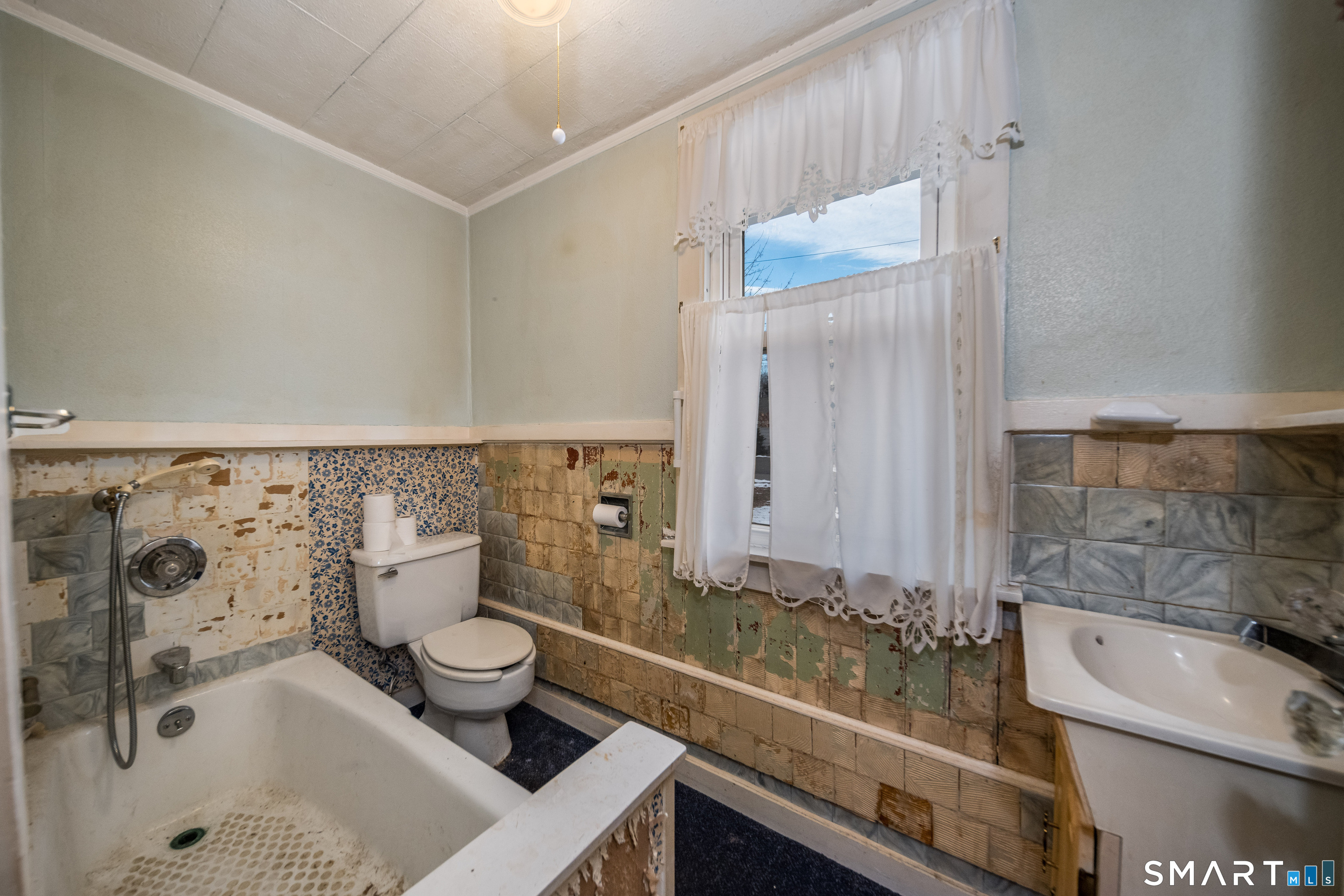 38 Grove Street Branford, CT 06405 - Photo 8 of 20 a bathroom with a sink and a mirror