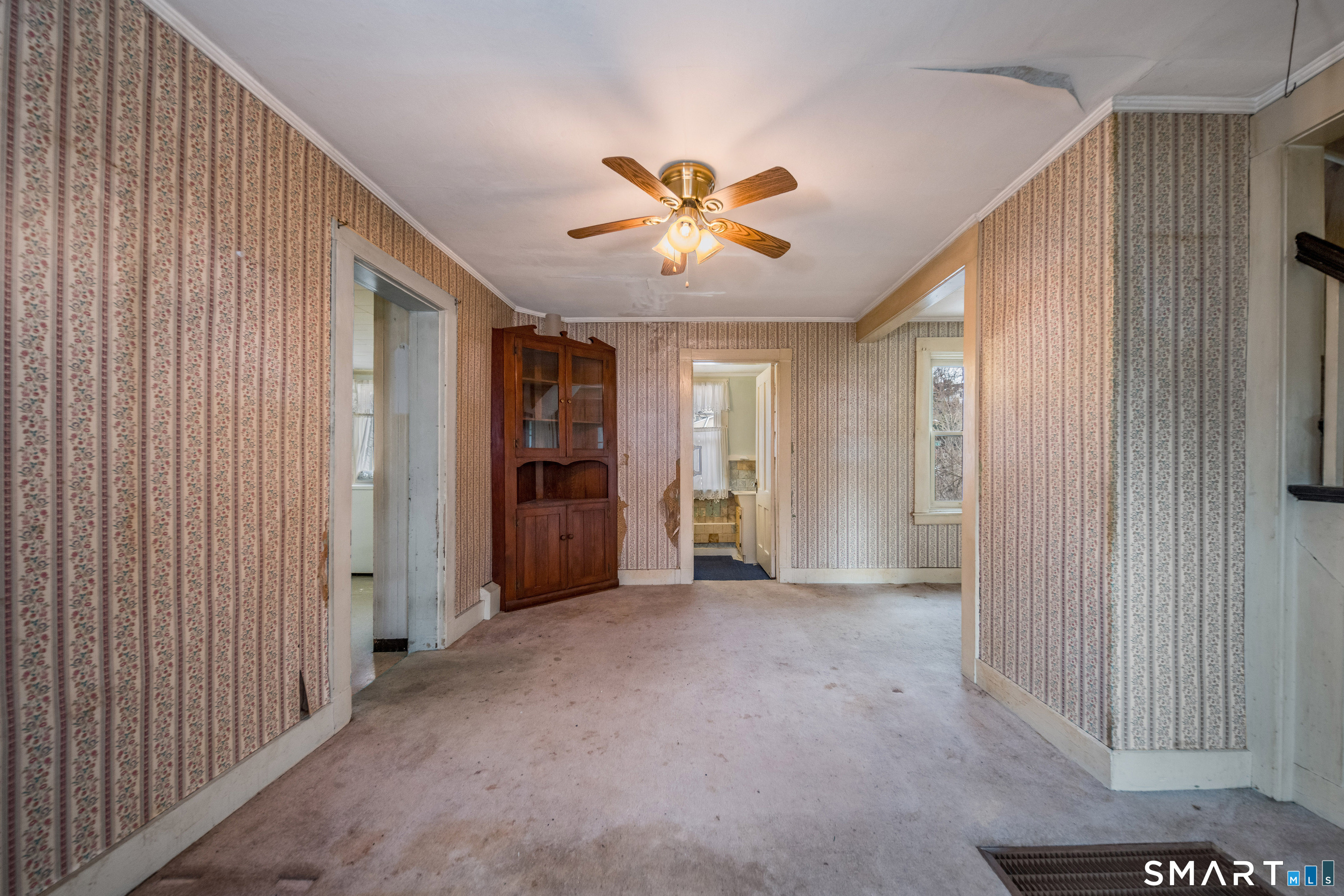 38 Grove Street Branford, CT 06405 - Photo 9 of 20 a view of an empty room with a window