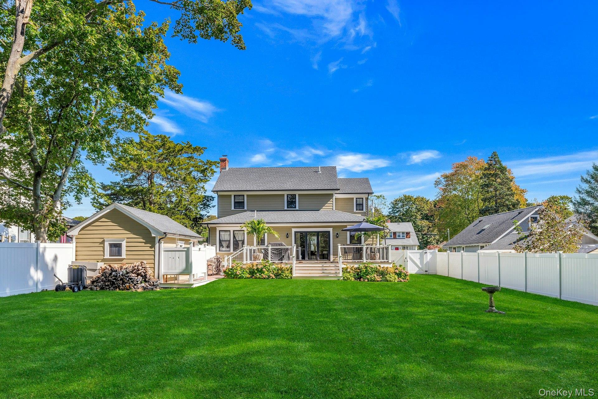 619 Bailey Avenue Greenport, NY 11944 - Photo 26 of 34 Lawn, Garage, Deck, Back of House