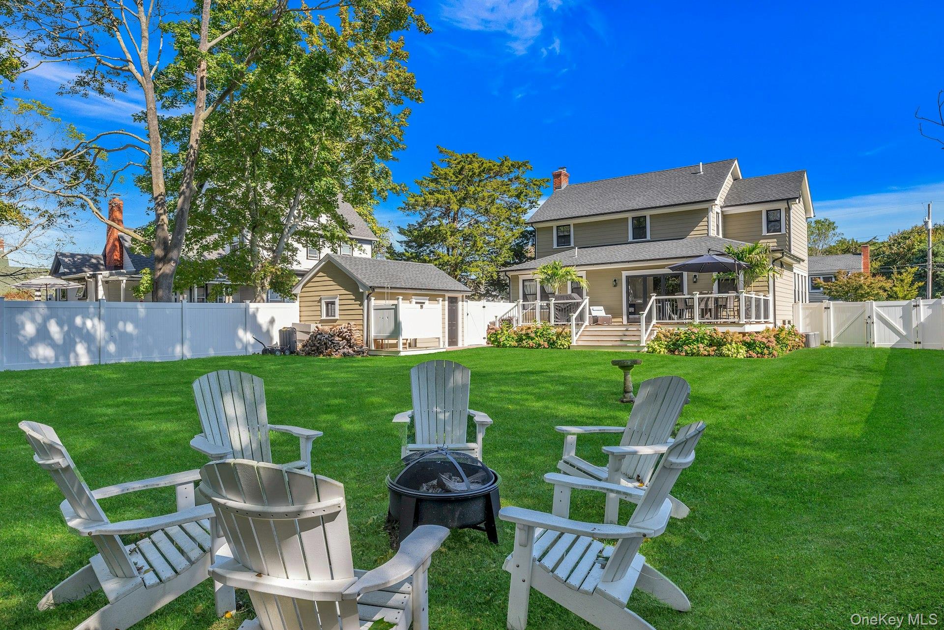619 Bailey Avenue Greenport, NY 11944 - Photo 28 of 34 Fire Pit, Lawn, Garage, Deck, Back of House