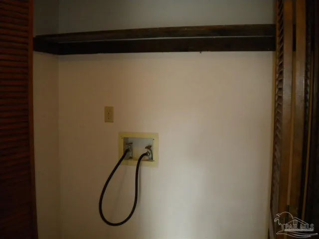 a bathroom with a shower and a mirror