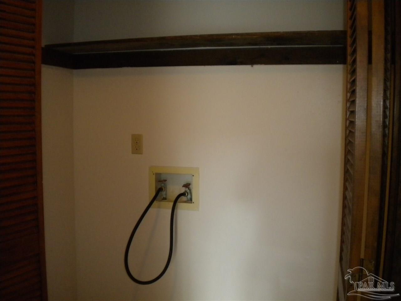 3262 Maplewood Drive, Unit B Gulf Breeze, FL 32563 - Photo 14 of 15 a bathroom with a shower and a mirror