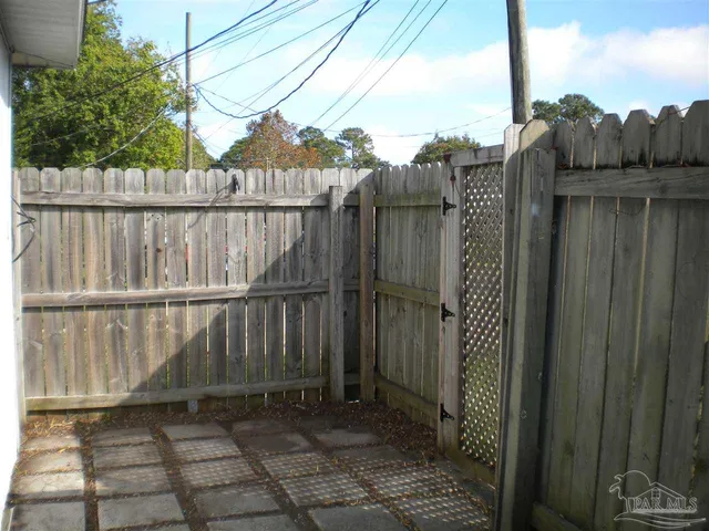 a view of a balcony with wooden fence