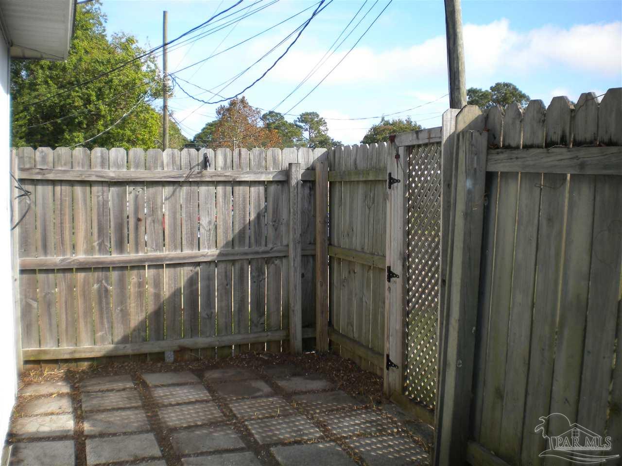 3262 Maplewood Drive, Unit B Gulf Breeze, FL 32563 - Photo 15 of 15 a view of a balcony with wooden fence