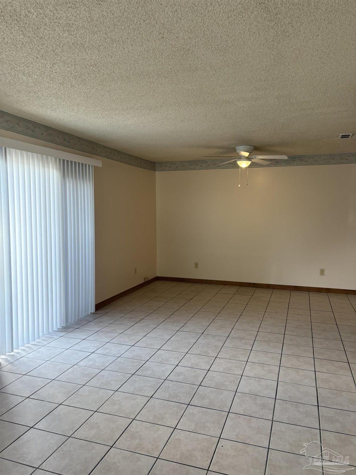 3262 Maplewood Drive, Unit B Gulf Breeze, FL 32563 - Photo 5 of 15 an empty room with a bench
