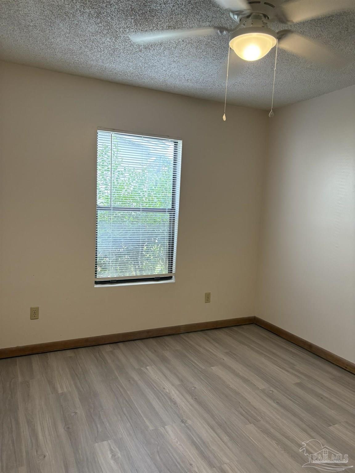 3262 Maplewood Drive, Unit B Gulf Breeze, FL 32563 - Photo 9 of 15 an empty room with a window