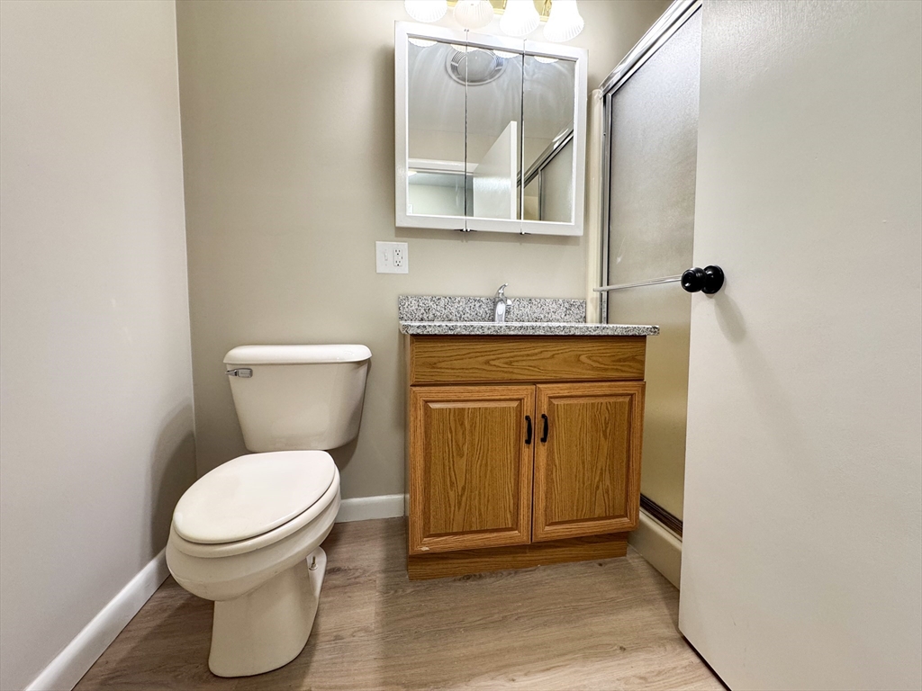 201 Pierce Road West Brookfield, MA 01585 - Photo 12 of 27 a bathroom with a toilet a sink and mirror
