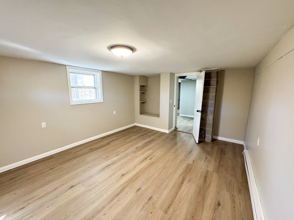 201 Pierce Road West Brookfield, MA 01585 - Photo 14 of 27 an empty room with wooden floor and windows