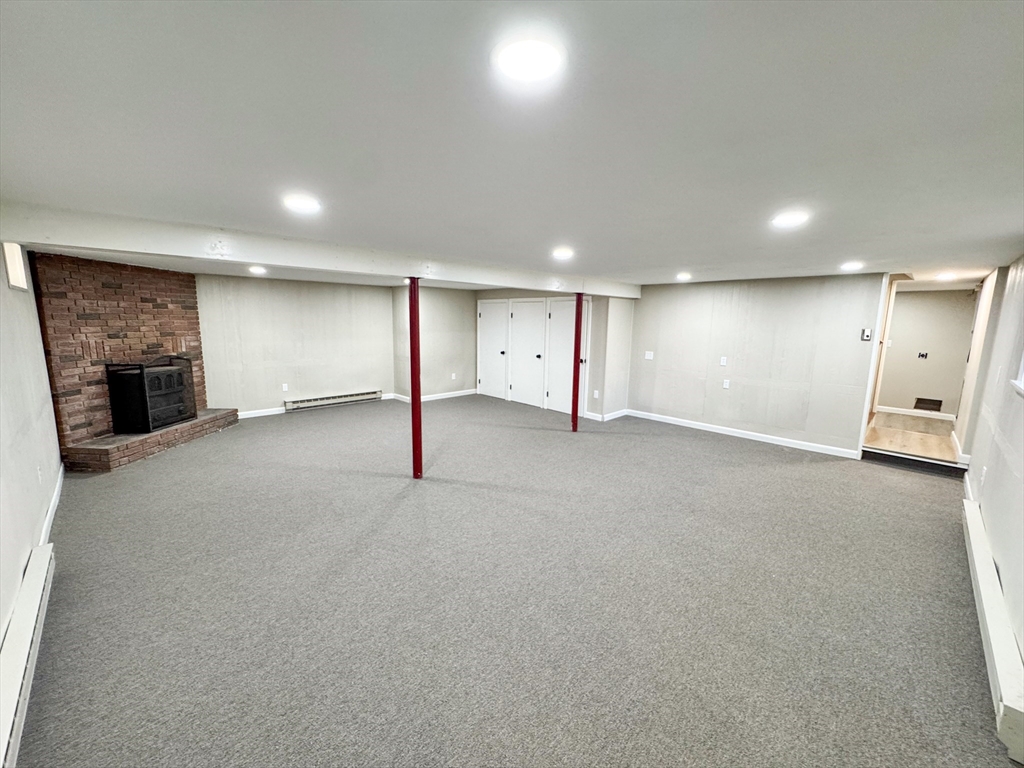 201 Pierce Road West Brookfield, MA 01585 - Photo 16 of 27 an empty room with fireplace and window