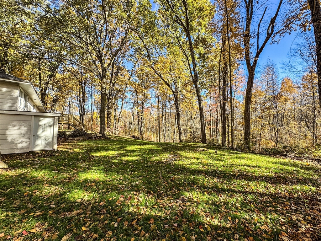 201 Pierce Road West Brookfield, MA 01585 - Photo 3 of 27 a yard with trees in the background