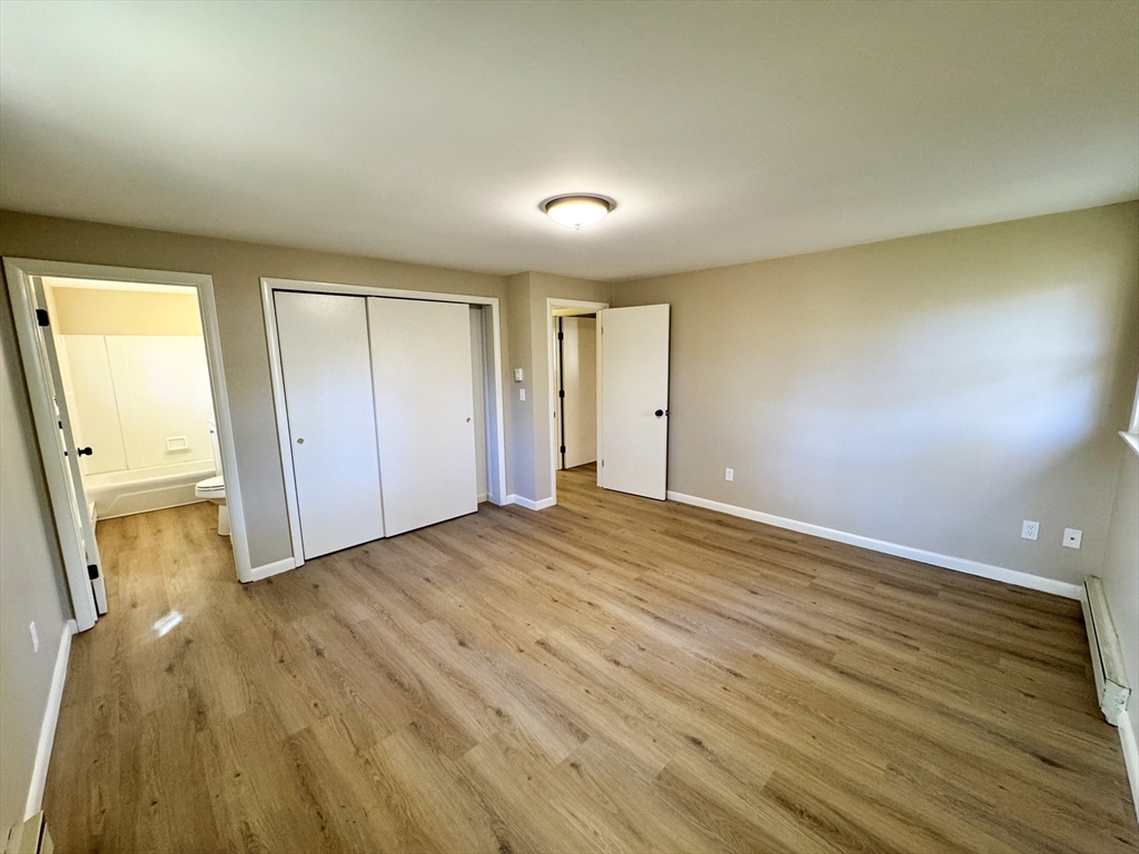 201 Pierce Road West Brookfield, MA 01585 - Photo 8 of 27 wooden floor in an empty room with a window