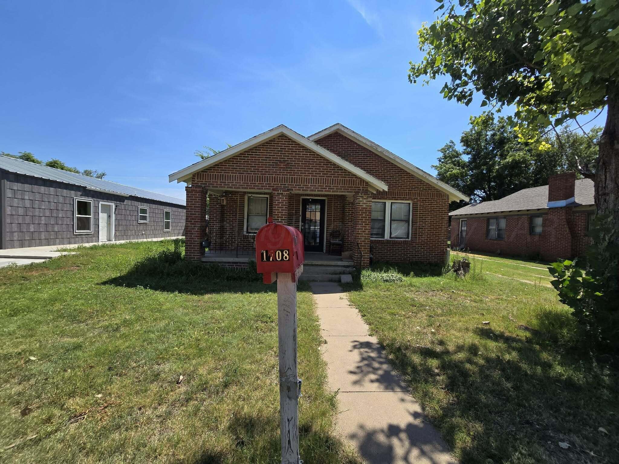 2706 Ridgemere Boulevard Amarillo, TX 79107 - Photo 1 of 49 a front view of a house with garden
