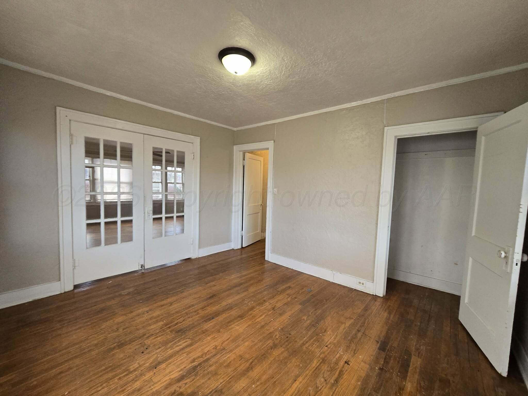 2706 Ridgemere Boulevard Amarillo, TX 79107 - Photo 12 of 49 a view of empty room with wooden floor and fan