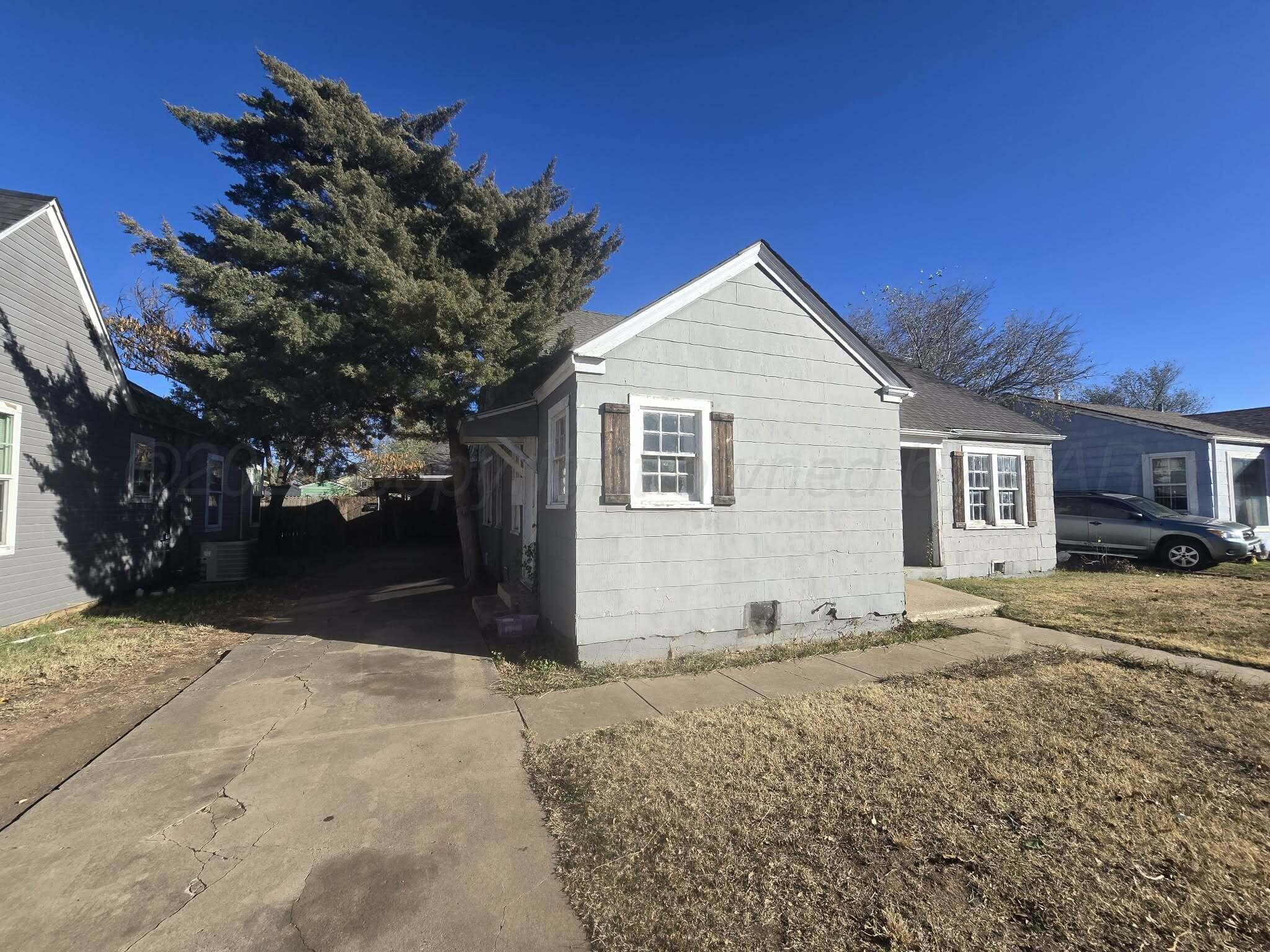 2706 Ridgemere Boulevard Amarillo, TX 79107 - Photo 20 of 49 a view of a house with a yard