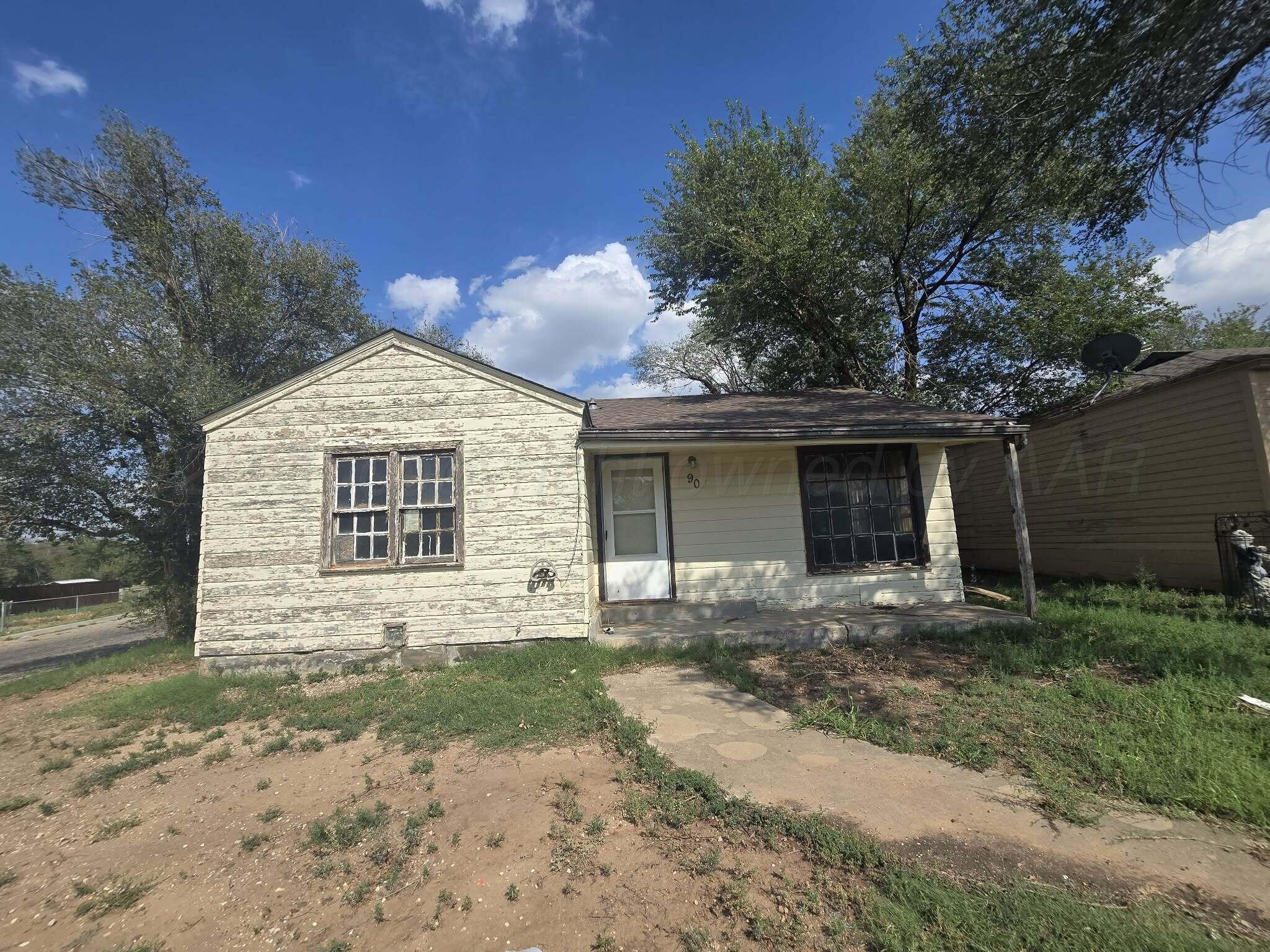 2706 Ridgemere Boulevard Amarillo, TX 79107 - Photo 32 of 49 a front view of a house with a yard and garage