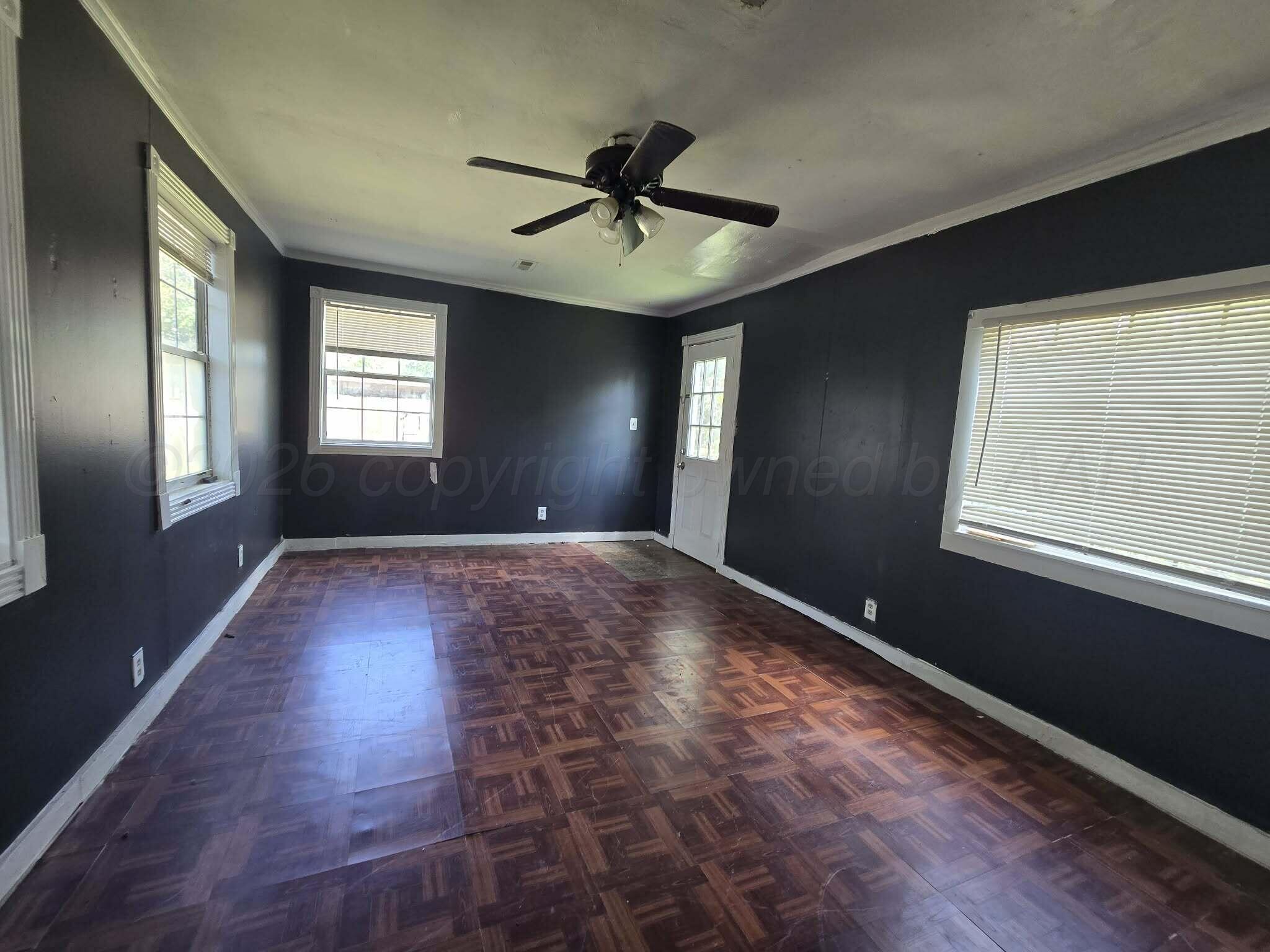 2706 Ridgemere Boulevard Amarillo, TX 79107 - Photo 36 of 49 a view of a livingroom with a ceiling fan and window