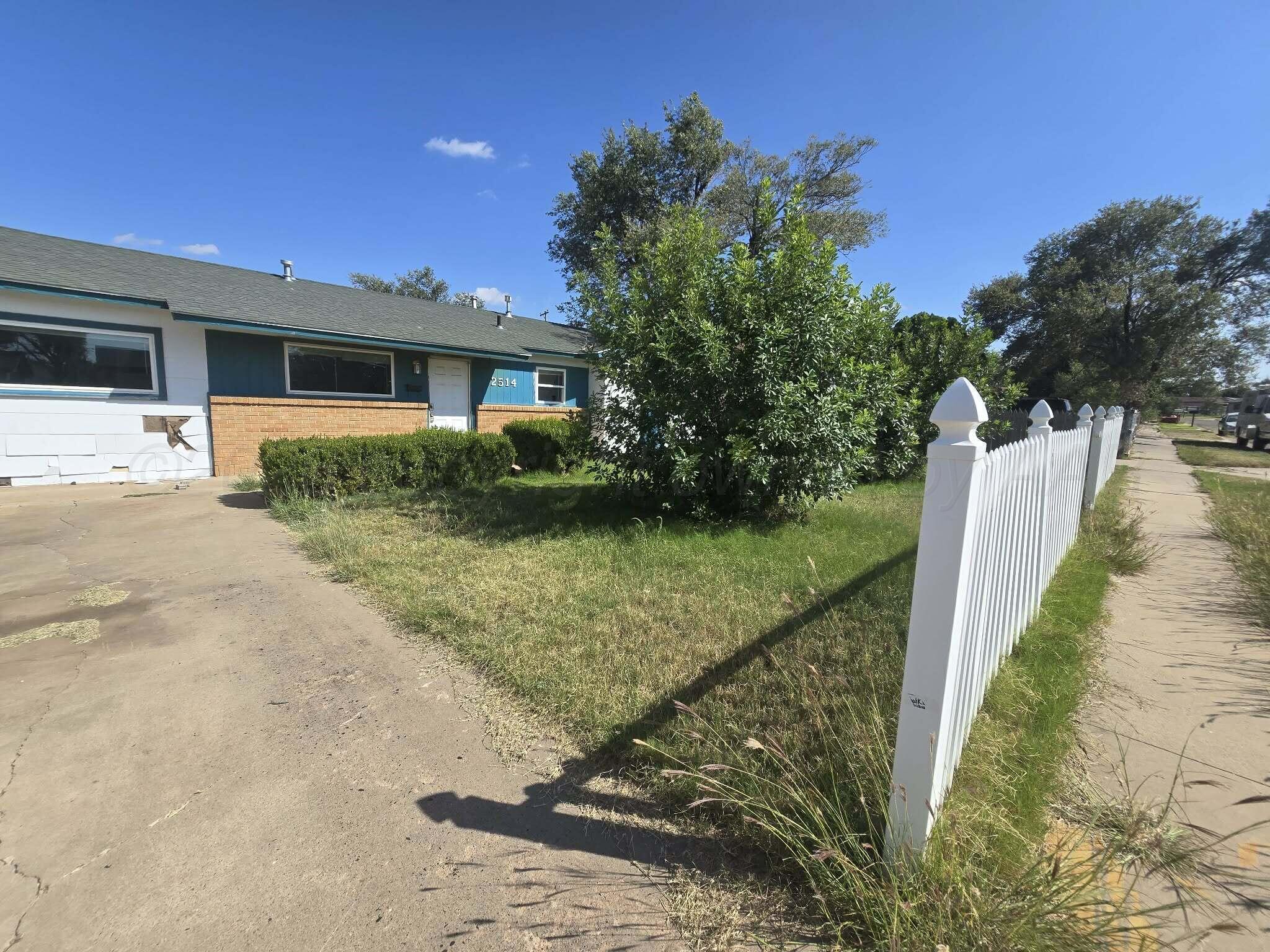 2706 Ridgemere Boulevard Amarillo, TX 79107 - Photo 43 of 49 a front view of a house with garden