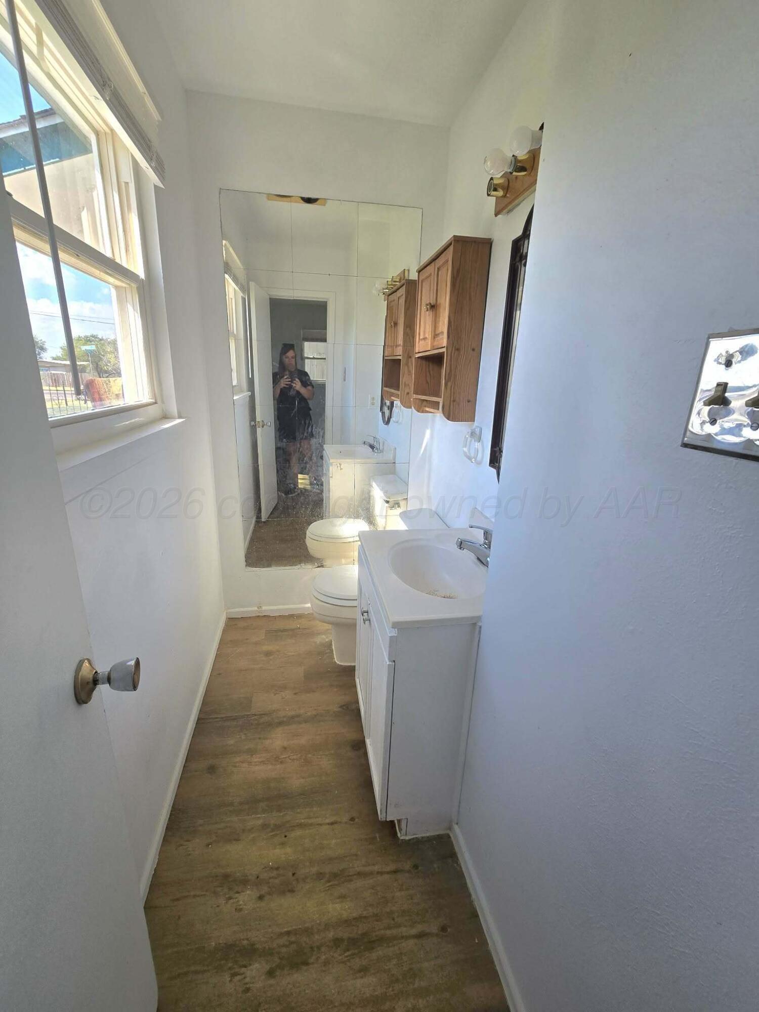 2706 Ridgemere Boulevard Amarillo, TX 79107 - Photo 46 of 49 a view of a hallway with wooden floor and staircase