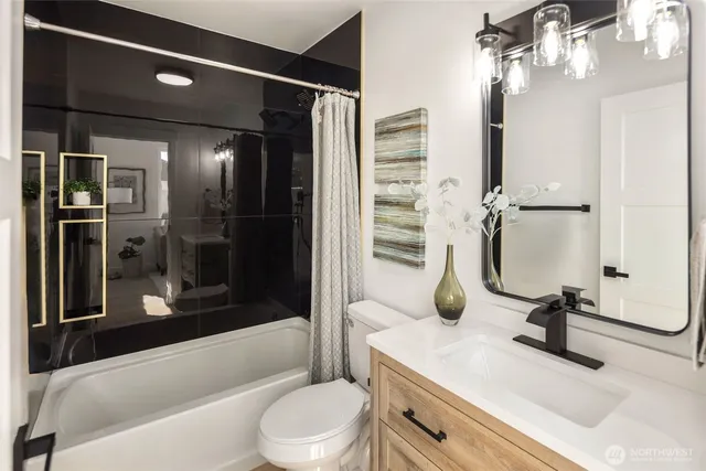 a bedroom with a bed and a tv