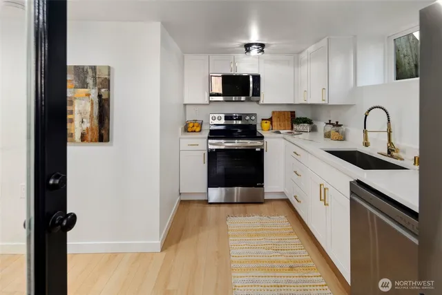 a kitchen with a refrigerator and cabinets