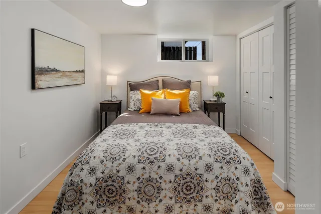 a bedroom with furniture and a wooden floor