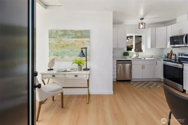 a kitchen with stainless steel appliances a refrigerator stove microwave and sink